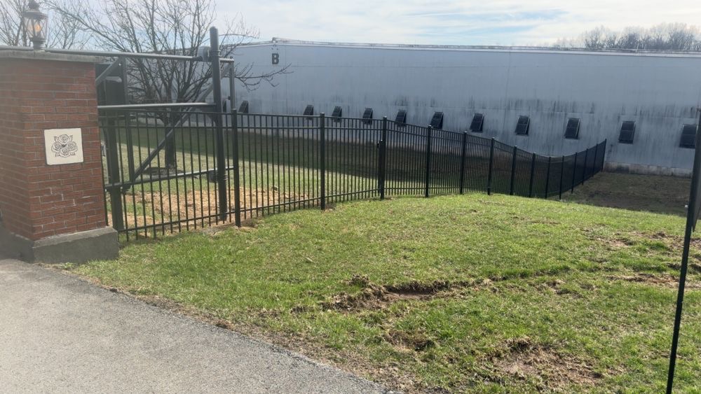 Aluminum perimeter fencing at Four Roses Distillery barrel warehouses