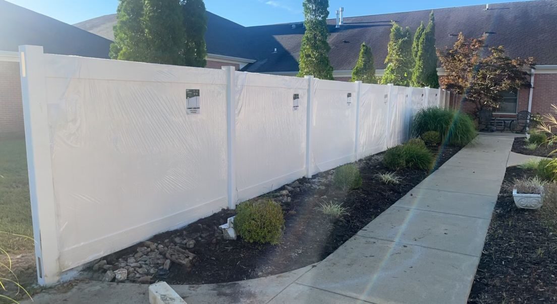 White vinyl perimeter fence at municipal property — S&S Fencing Kentucky