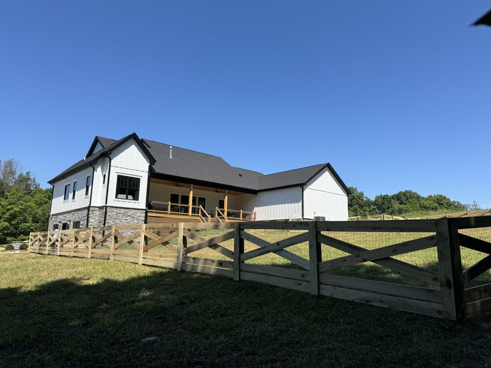 Wood split-rail fence with farmhouse — S&S Fencing rural residential